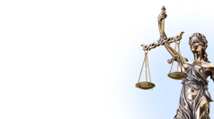 Lady justice scale representing the true cost of non-compliance